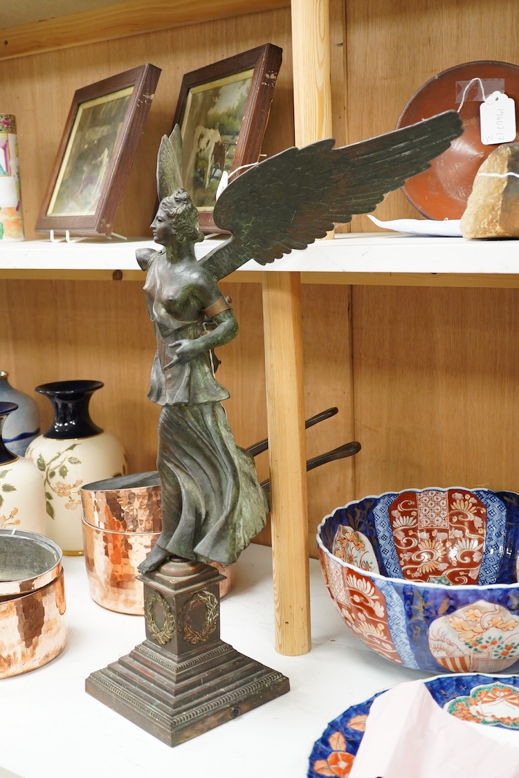 After the antique, an early 20th century bronze figure Winged Victory, on associated base, 60cm high